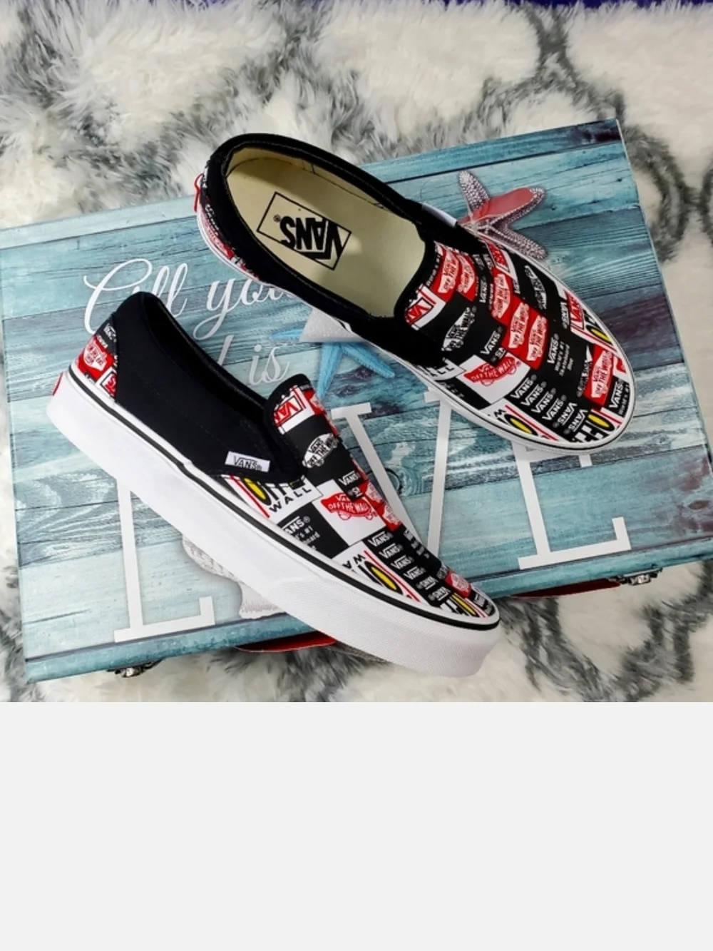 Vans Black Slip-On Sneakers with Red, White & Yellow Logo Print
